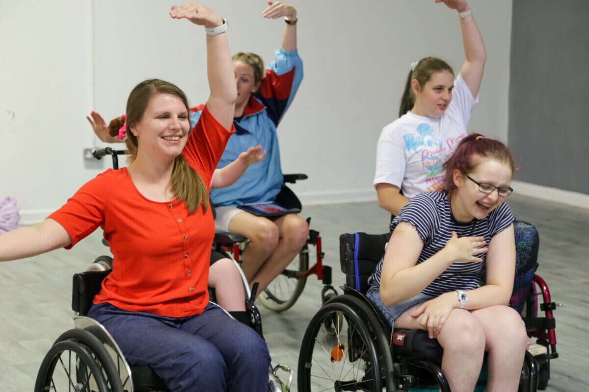 Wheelchair dancers rehearsing together in a studio